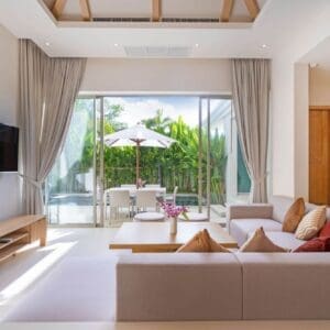 A living room with a large window and a big couch